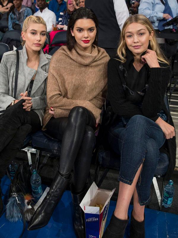 Kendall Jenner sits court side during NY Knicks game at Madison Square Garden with with Hailey Baldwin and Gigi Hadid