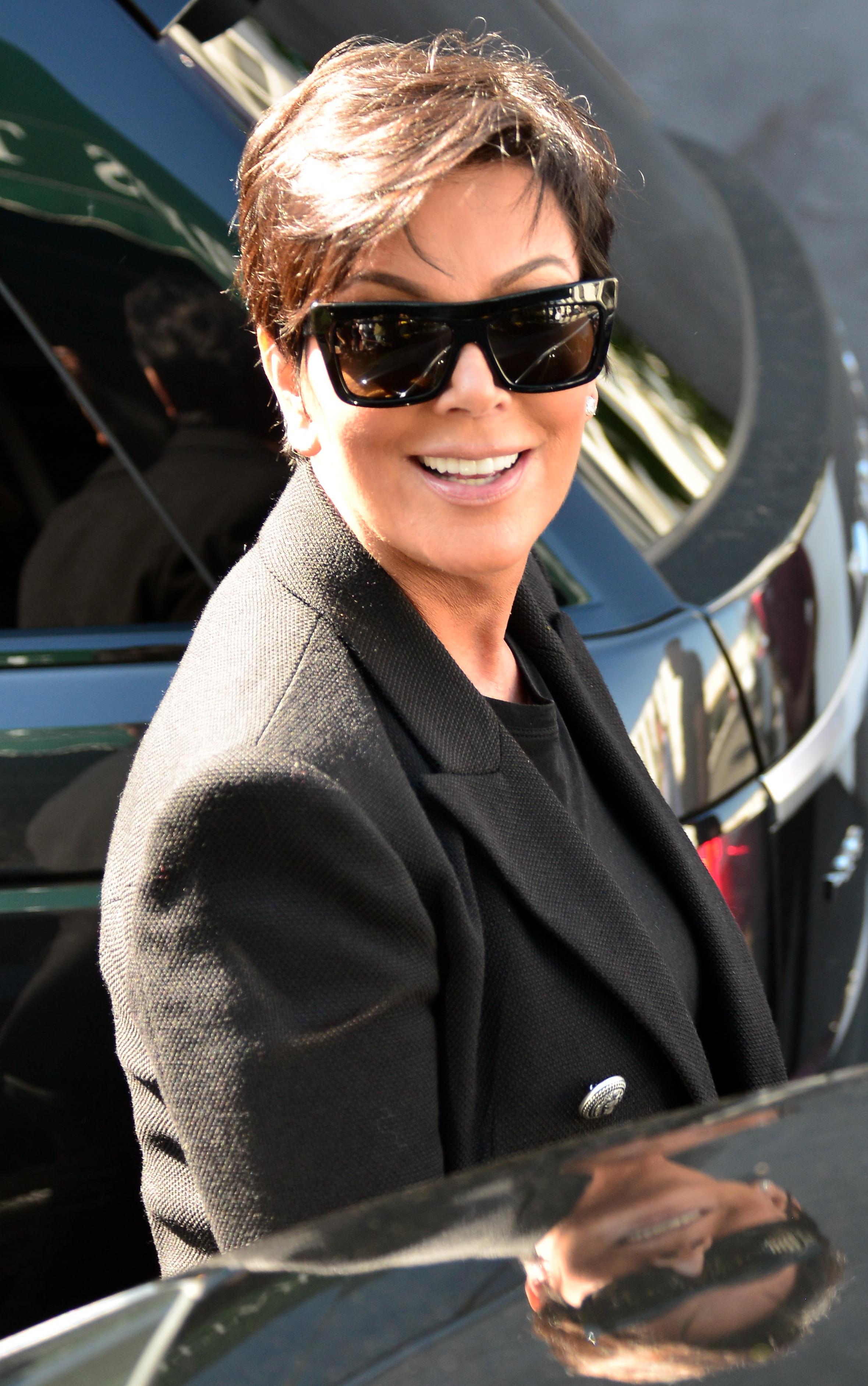 Kardashian family matriarch, Kris Jenner, is all smiles as she leaves Emilio&#8217;s Restaurant with Scott DIsick and stops to talk to daughter Kourtney who came to pick him up in Encino, CA