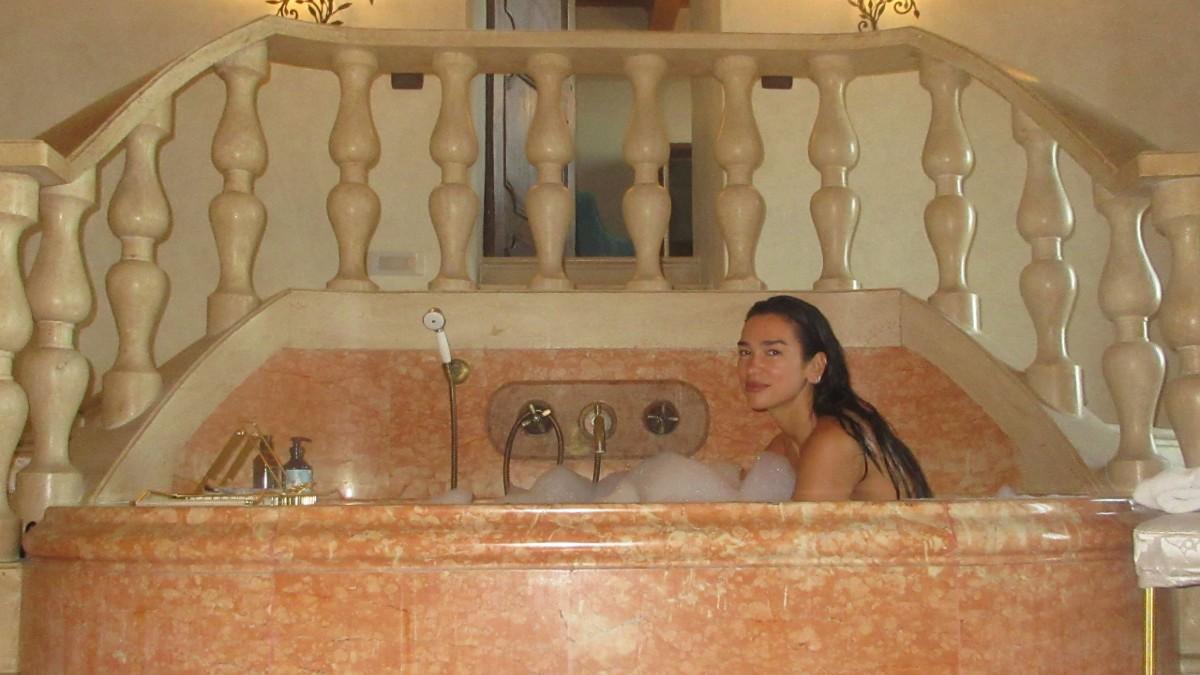 Image of Dua Lipa shared a photo of herself bathing in a stunning bathtub. 