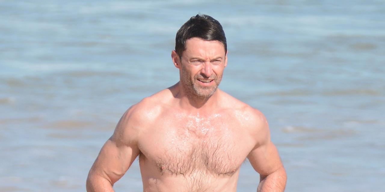 Hugh Jackman goes for a swim at Bondi ahead of concert.