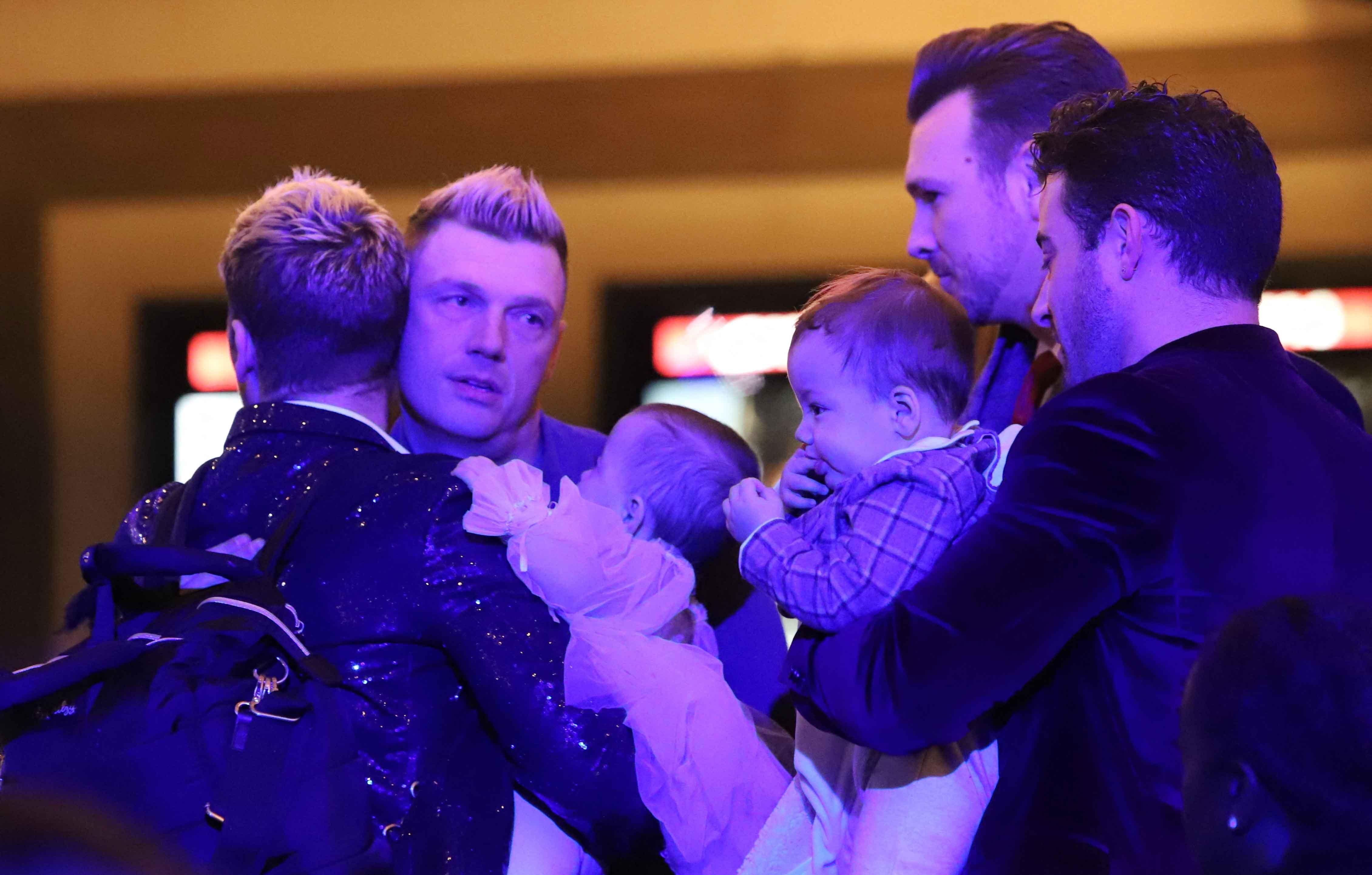 nick carter and sister angel try to embrace holiday at event with lance bass and his family