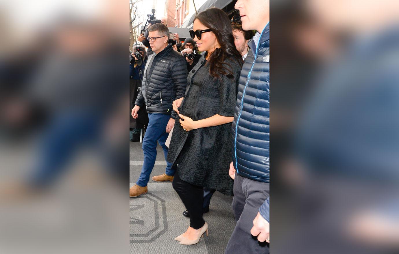 Meghan Markle Cradles bump outside The Mark Hotel