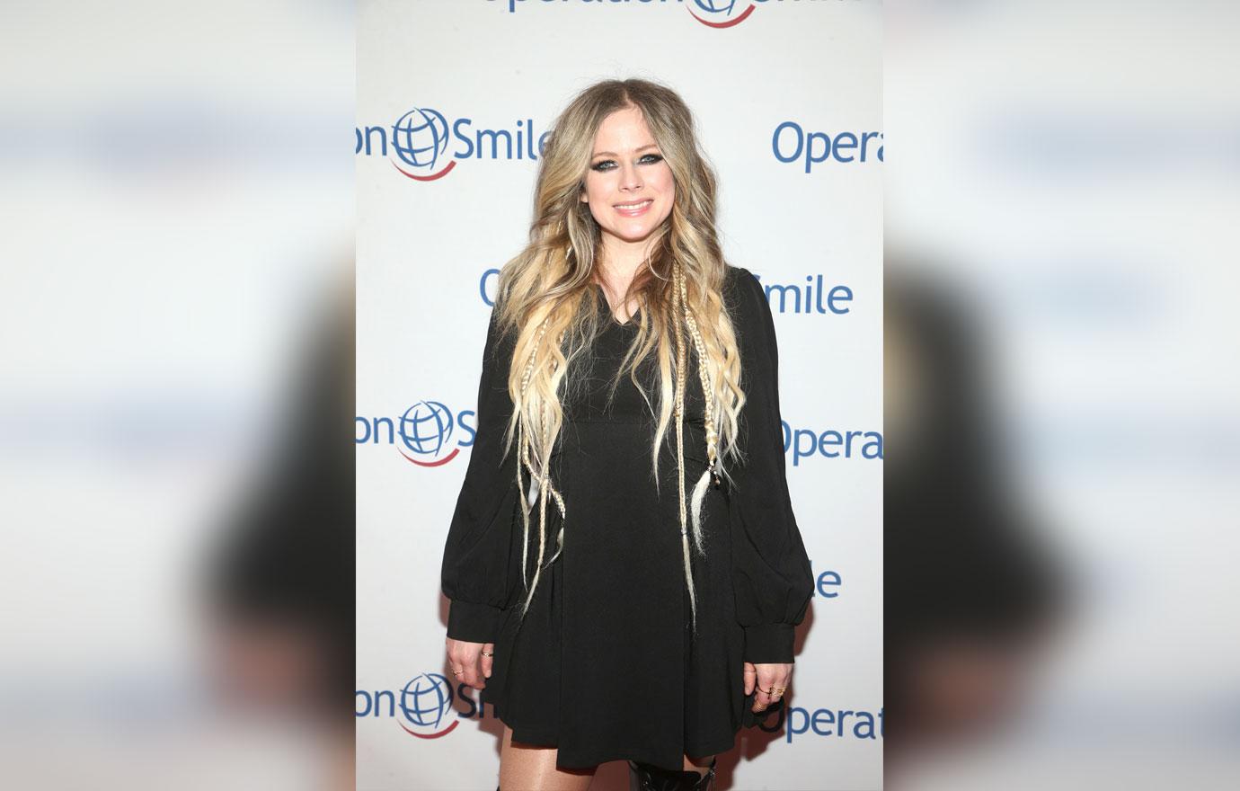 Avril Lavigne Wearing A Black Mini Dress on Red Carpet