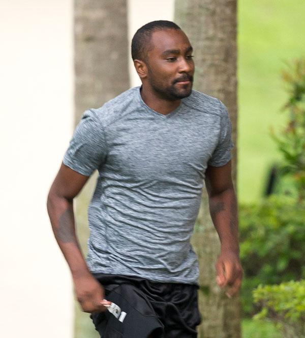 Nick gordon looks confused being served papers lawsuit