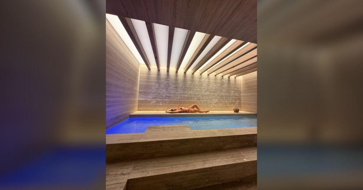 image of Kate Hudson chilled by her indoor pool while on a Italian getaway.