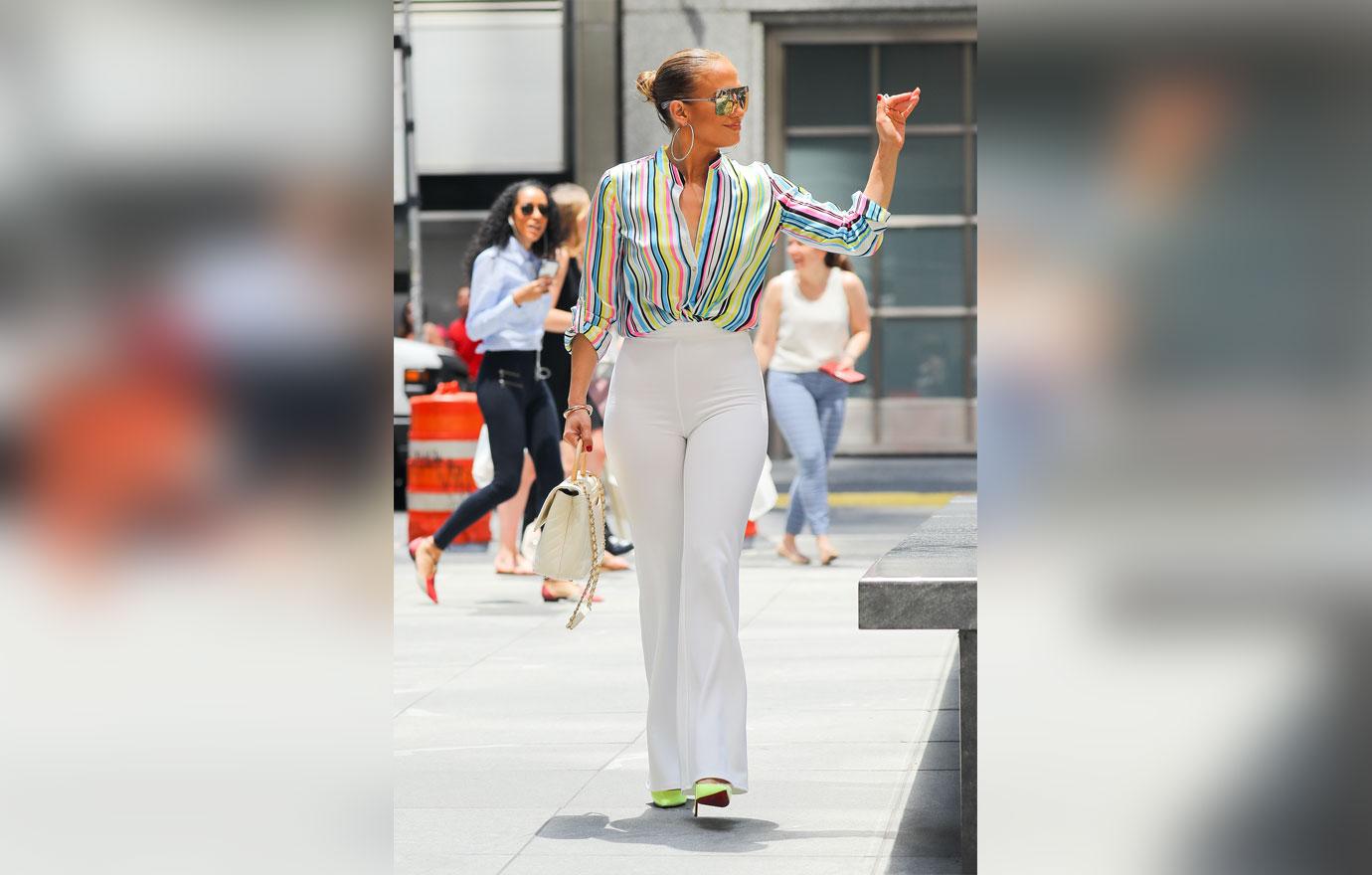 Jennifer lopez slays rainbow striped shirt hip hugging pants 5