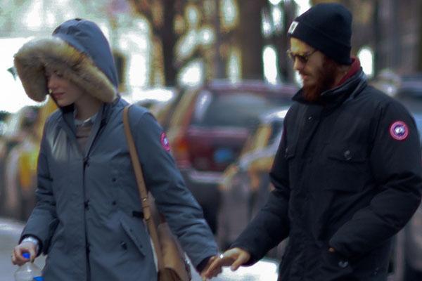 Emma Stone and Andrew Garfield exit Cafe Cluny while holding hands in the freezing temperatures