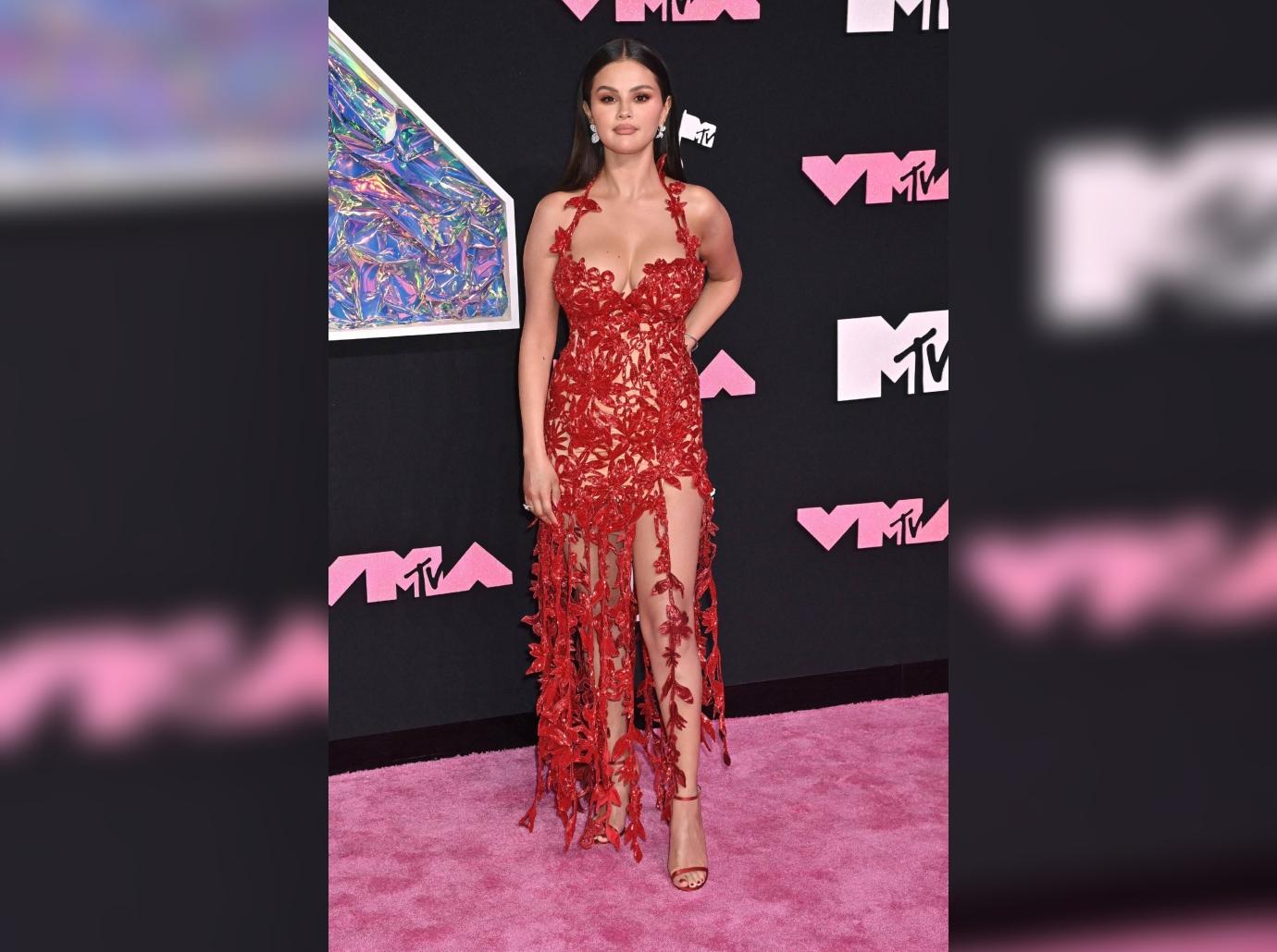 Selena Gomez teases near wardrobe malfunction as she poses in pink bathrobe  for sexy new photo