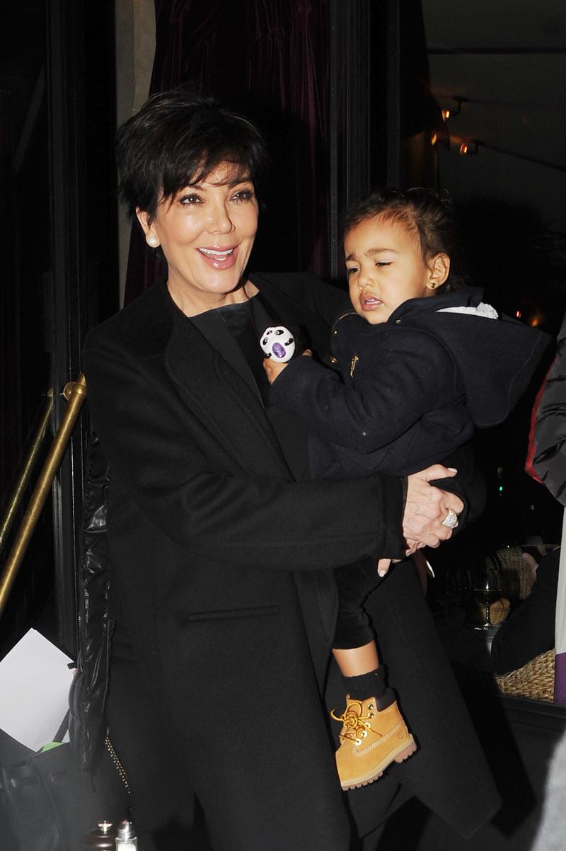 EXCLUSIVE: Grandma Kris Jenner carries baby North West to dinner in Paris