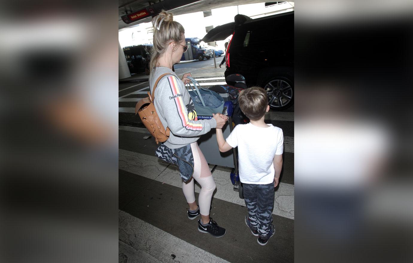 Pics January Jones Stays Close To Son Xander As They Arrive At Lax