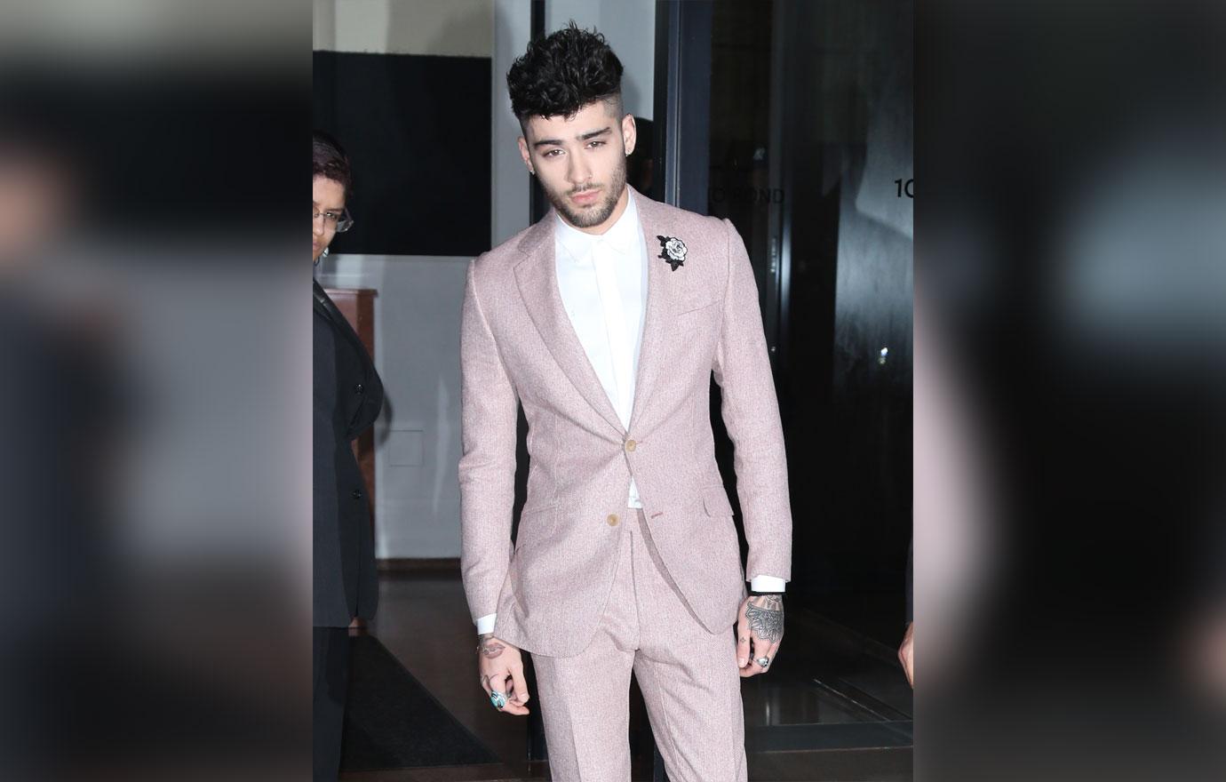 Zayn Malik heads to the Grammys sporting a white flower for #TimesUp