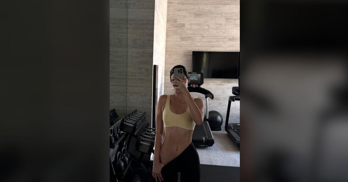 Image of Kendall Jenner stopped for a selfie at the gym.