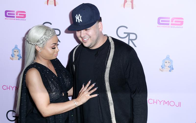 Blac Chyna and Rob Kardashian look happy as can be as they arrive on the purple carpet for her birthday party / Chymoji (emoji) release party at the Hard Rock Cafe in Hollywood, CA