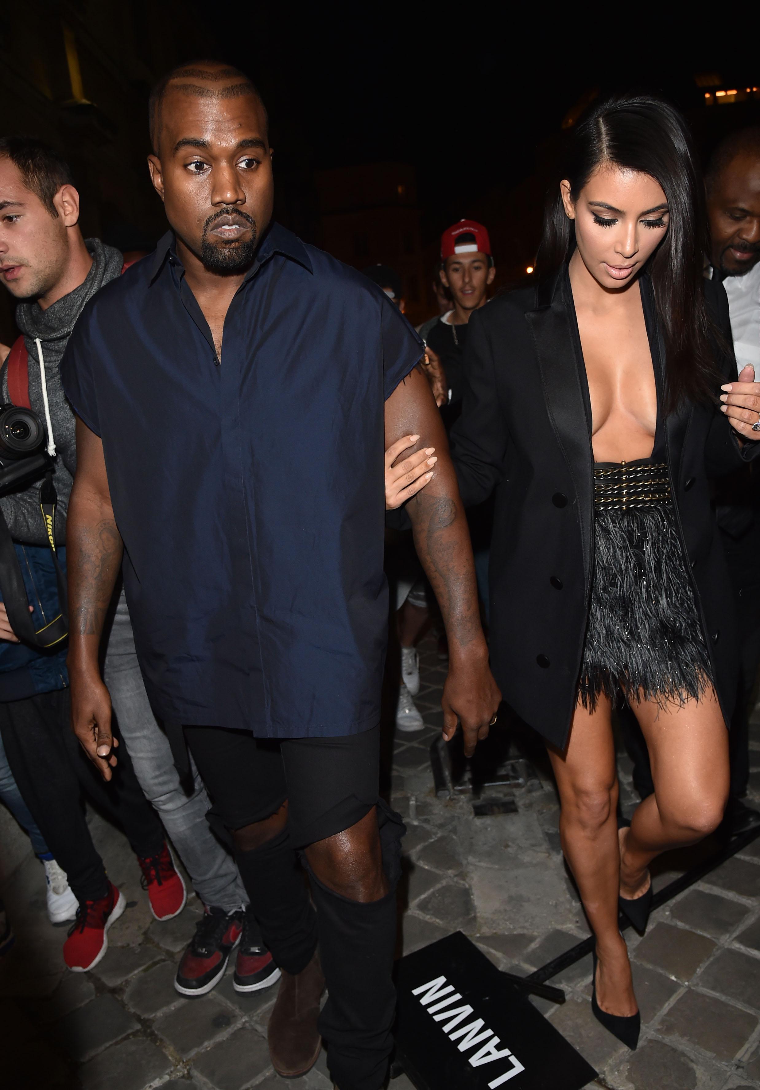 Kanye West and Kim Kardashian attend the Lanvin show