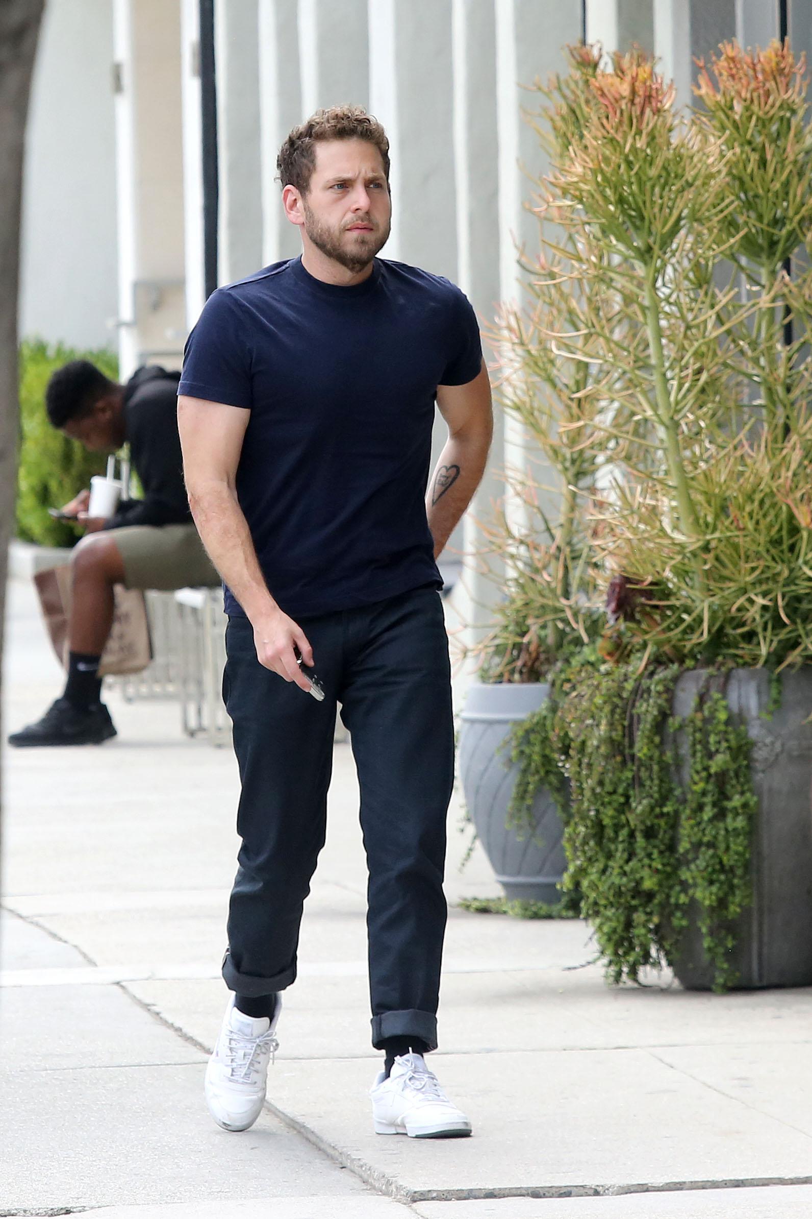 EXCLUSIVE: Jonah Hill shows off his guns in a tight fitted T shirt