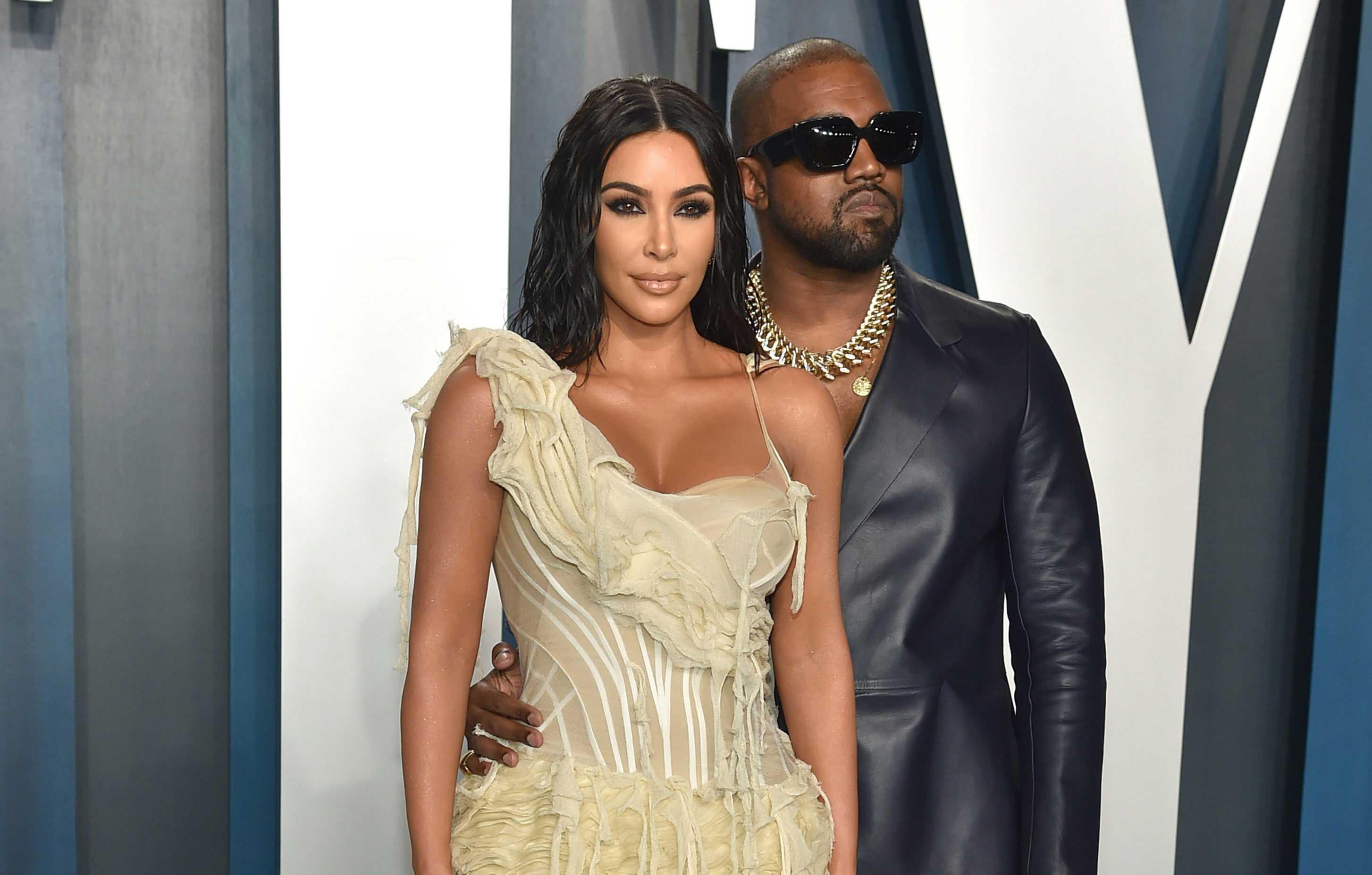 Kim Kardashian Nearly Spills Out of Her Plunging Lace Dress Before Kanye's  Surprise Show