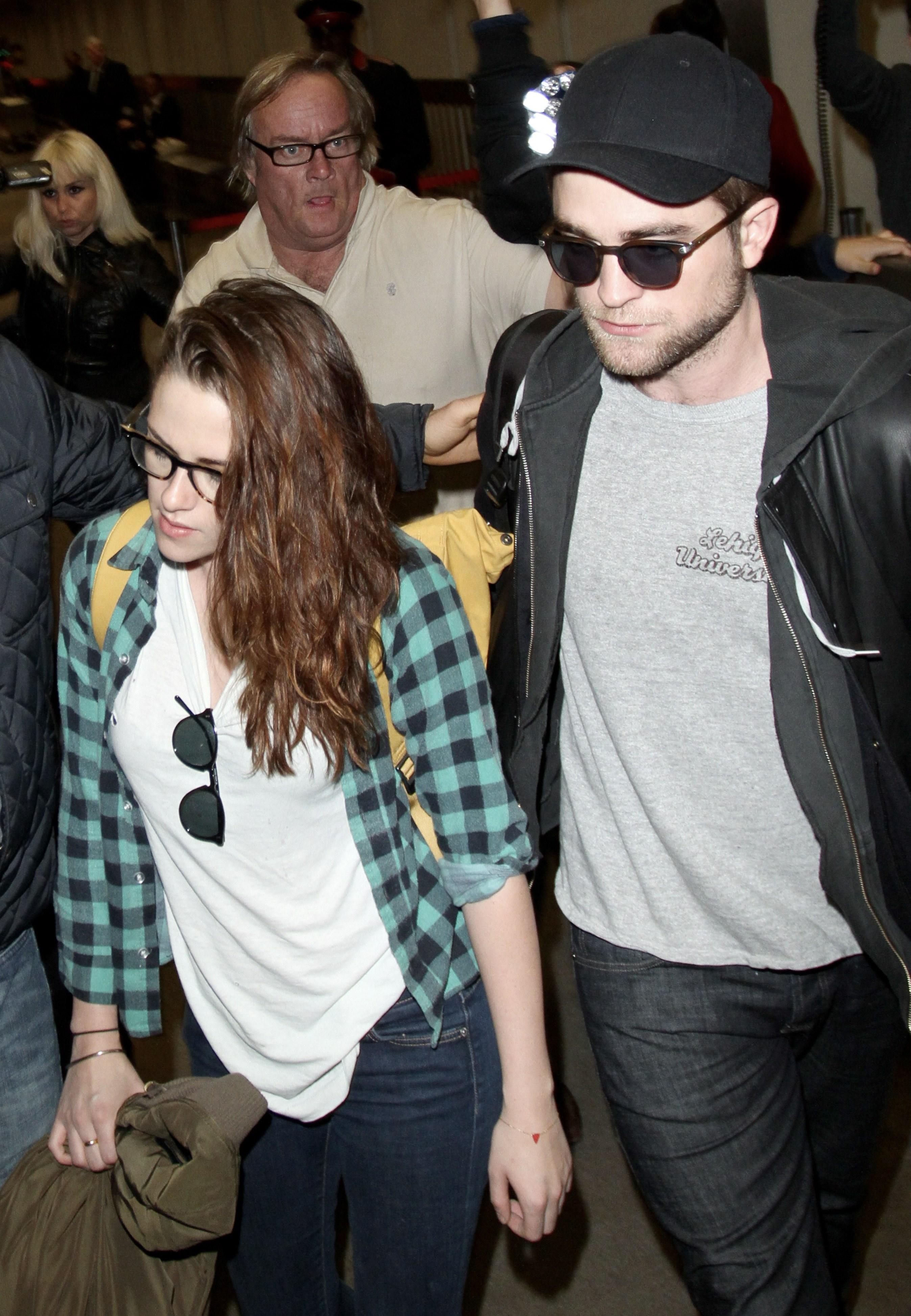 Robert Pattinson and Kristen Stewart arrive back in LA