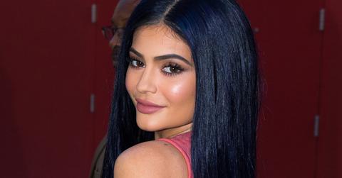 Kylie Jenner shows off dark blue hair at Sugar Factory Orlando grand opening.