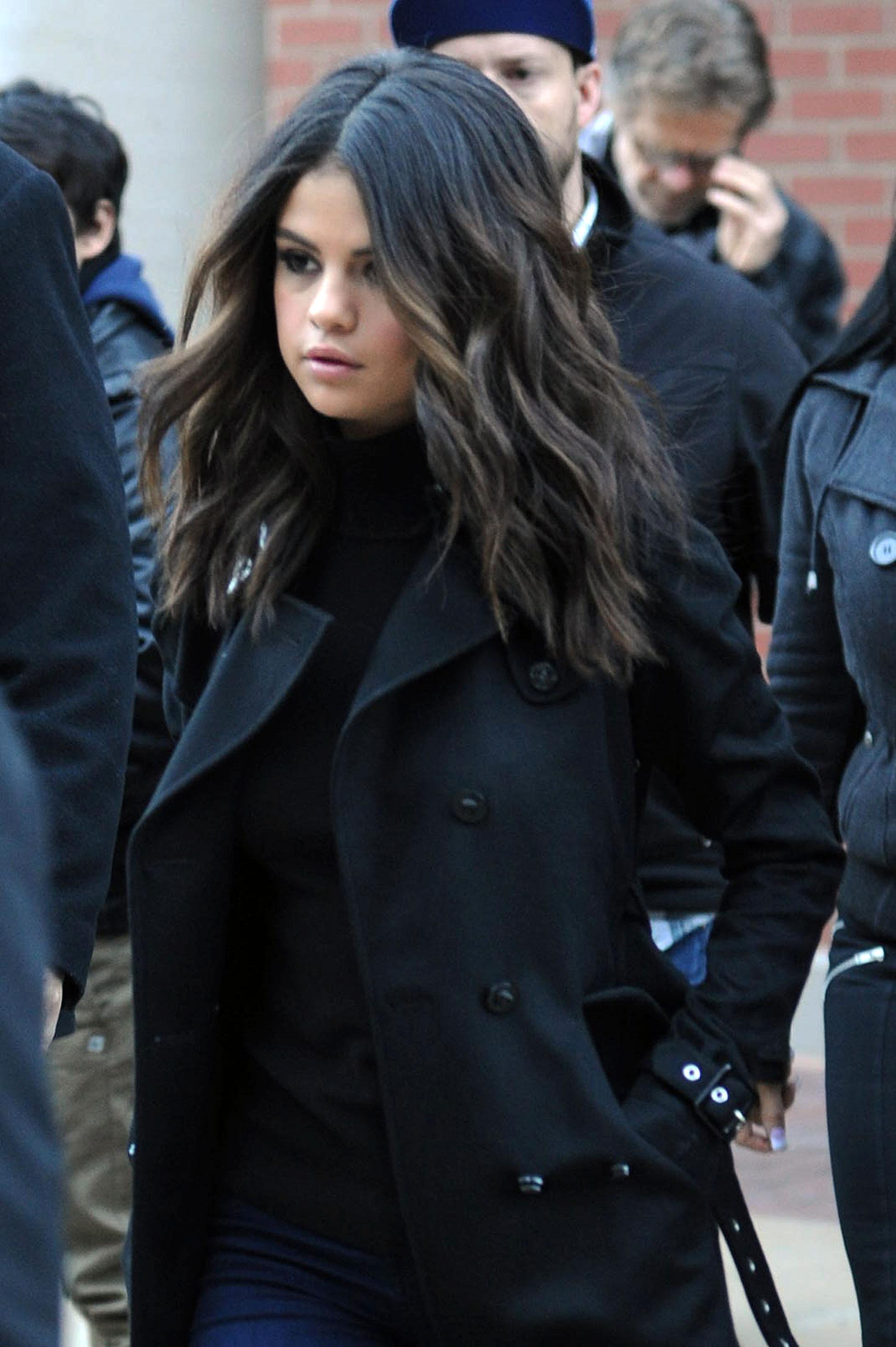 Selena Gomez puts on a brave face for her fans but looks downbeat between photo shoots in Utah