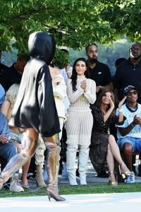 NEW YORK, NY - SEPTEMBER 07: (L-R) Tyga, Kylie Jenner, Kendall Jenner, Kim Kardashian, Carine Roitfeld and Pharrell Williams attend the Kanye West Yeezy Season 4 fashion show on September 7, 2016 in New York City. (Photo by Jamie McCarthy/Getty Images for Yeezy Season 4)