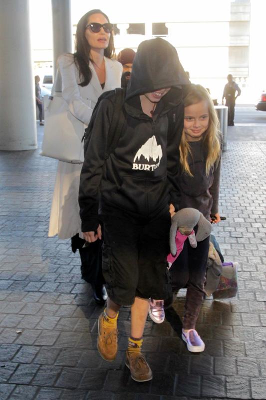 Angelina Jolie makes sure her kids are all in line at LAX