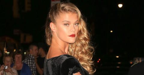 Nina Agdal shows it off as she arrives at the Harpers Bazaar party