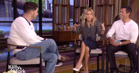 Photo of Nick Jonas, Kelly Ripa and Mark Consuelos.