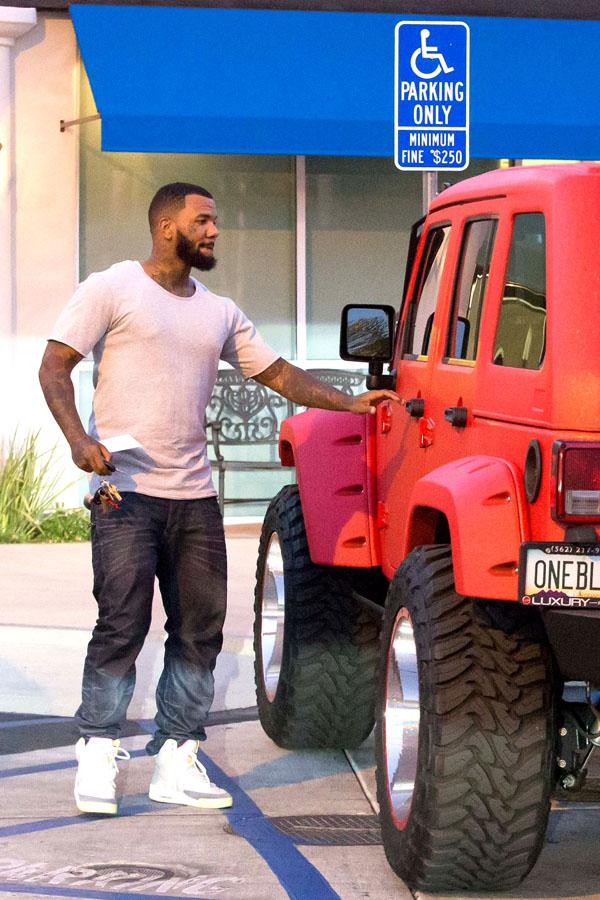 *EXCLUSIVE* The Game parks his sweet ride in a handicap spot while at the bank