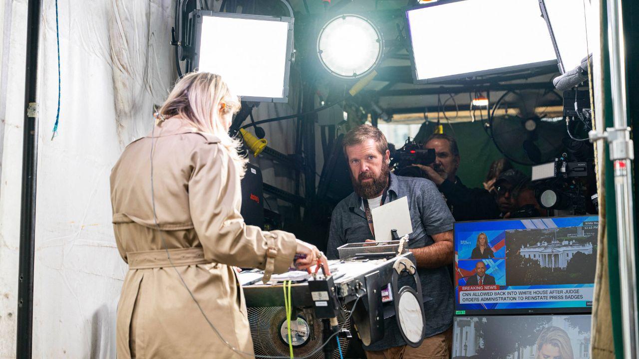 image of a CNN reporter preparing for a live-shot outside of the White House