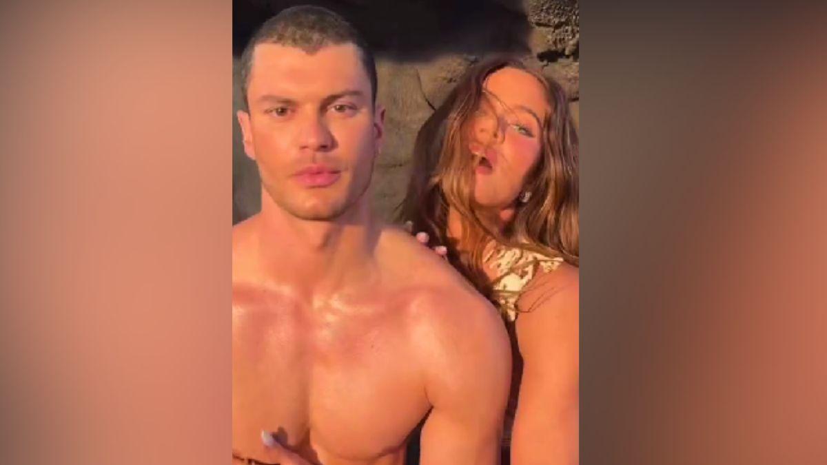 Image of Khloé Kardashian danced alongside a shirtless mystery man while promoting new perfume. 