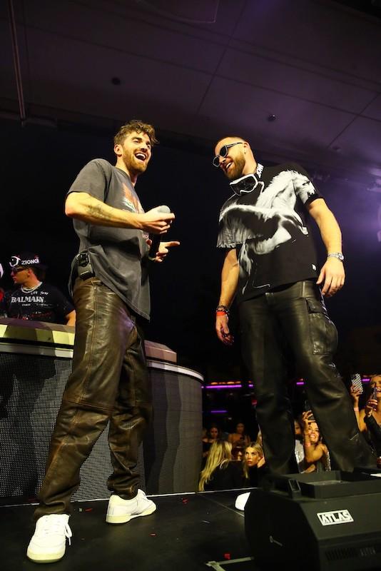 drew taggart of the chainsmokers and kansas city chiefs star travis kelce laughing on stage at xs nightclub inside wynn las vegas on feb photo credit danny mahoney