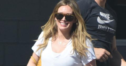 Hilary duff kissing her trainer