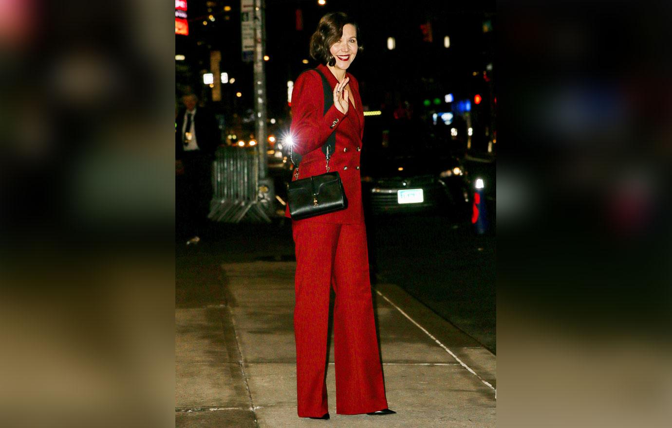 maggie gyllenhaal wears a red suit while leaving the late show with stephen colbert in nyc