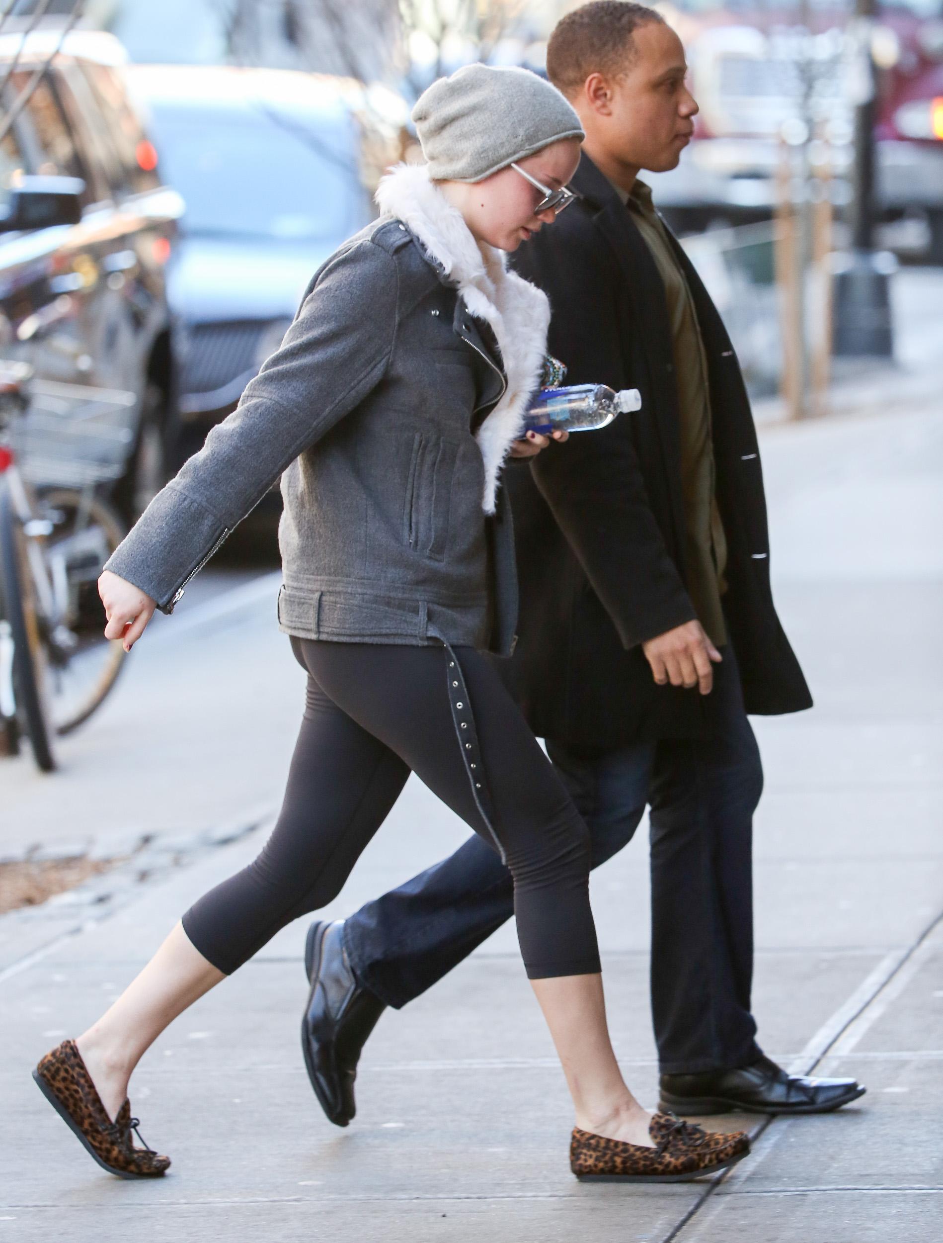 Jennifer Lawrence walking in her Leopard slippers in New York City