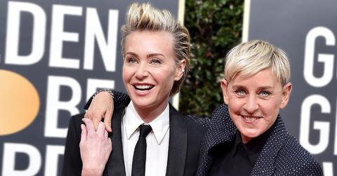 Portia De Rossi Wearing White Dress Shirt With Black Tie and Tuxedo Jacket Standing With Ellen Degeneres Wearing Black Dress Shirt and Black Crystal Studded Jacket