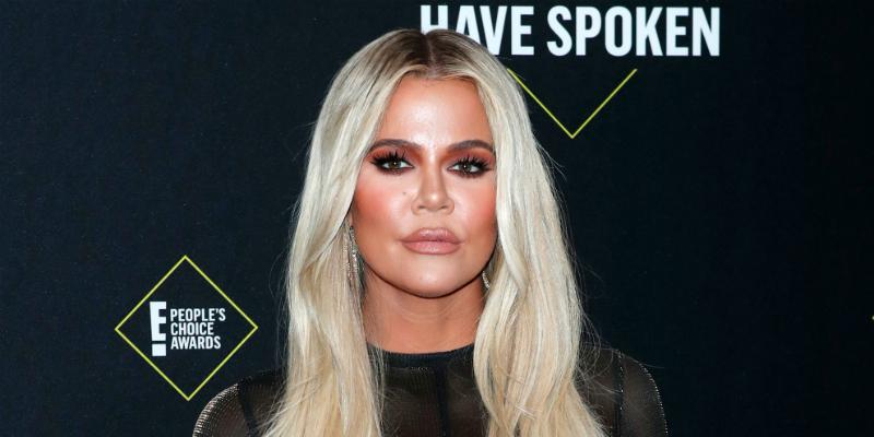 Khloe Kardashian wore a black, see-through, blouse with her hair dyed platinum blonde.