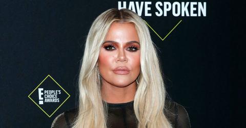 Khloe Kardashian wore a black, see-through, blouse with her hair dyed platinum blonde.