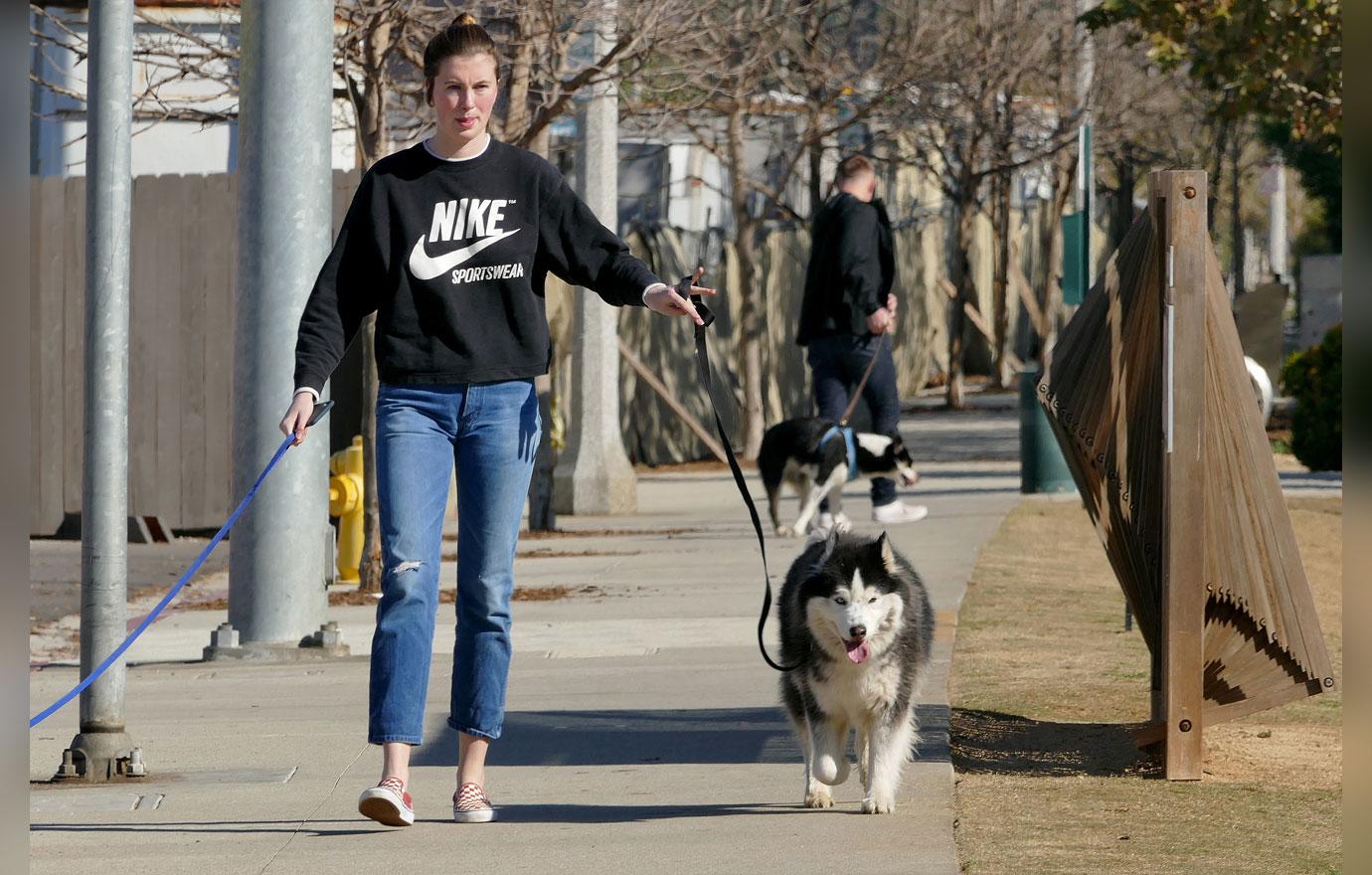 EXCLUSIVE: Ireland Baldwin takes her dogs for a walk in LA.