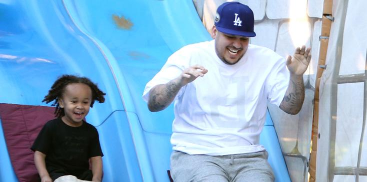 EXCLUSIVE: ***PREMIUM EXCLUSIVE RATES APPLY*** Rob Kardashian enjoys a day at Legoland with girlfriend Blac Chyna and rides a slide with her son King Cairo in LA