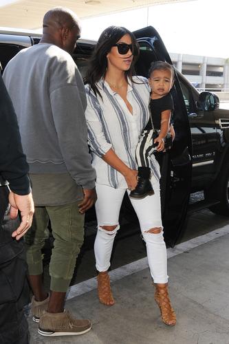 Kim Kardashian and Kanye West depart LA with daughter North