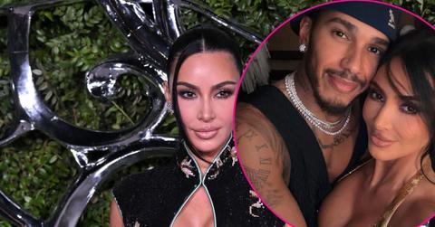 Image of Kim Kardashian taking a selfie with Lewis Hamilton.