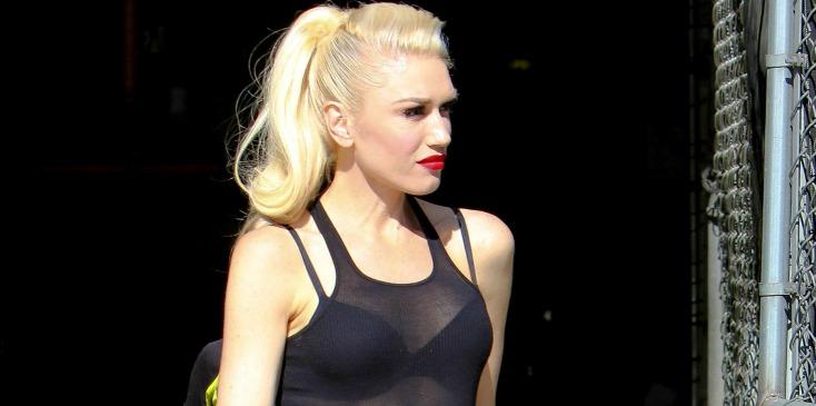 Gwen Stefani wears see-through white blouse over black bra at the studio