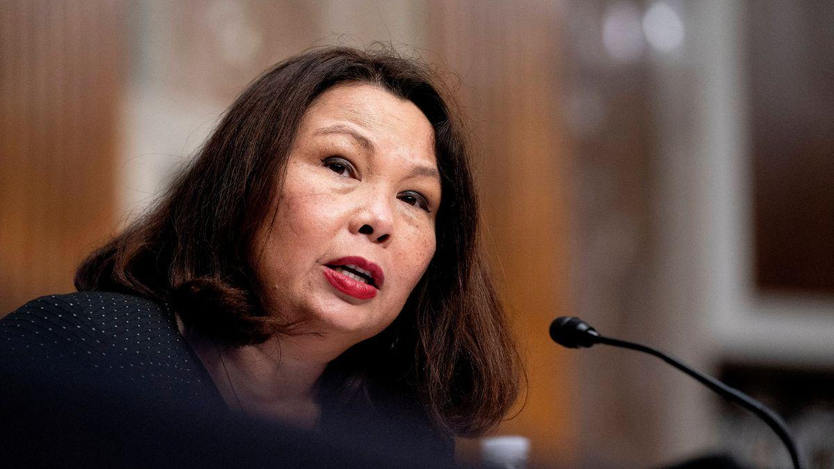 image of Tammy Duckworth replied by taking a shot at Donald Trump.