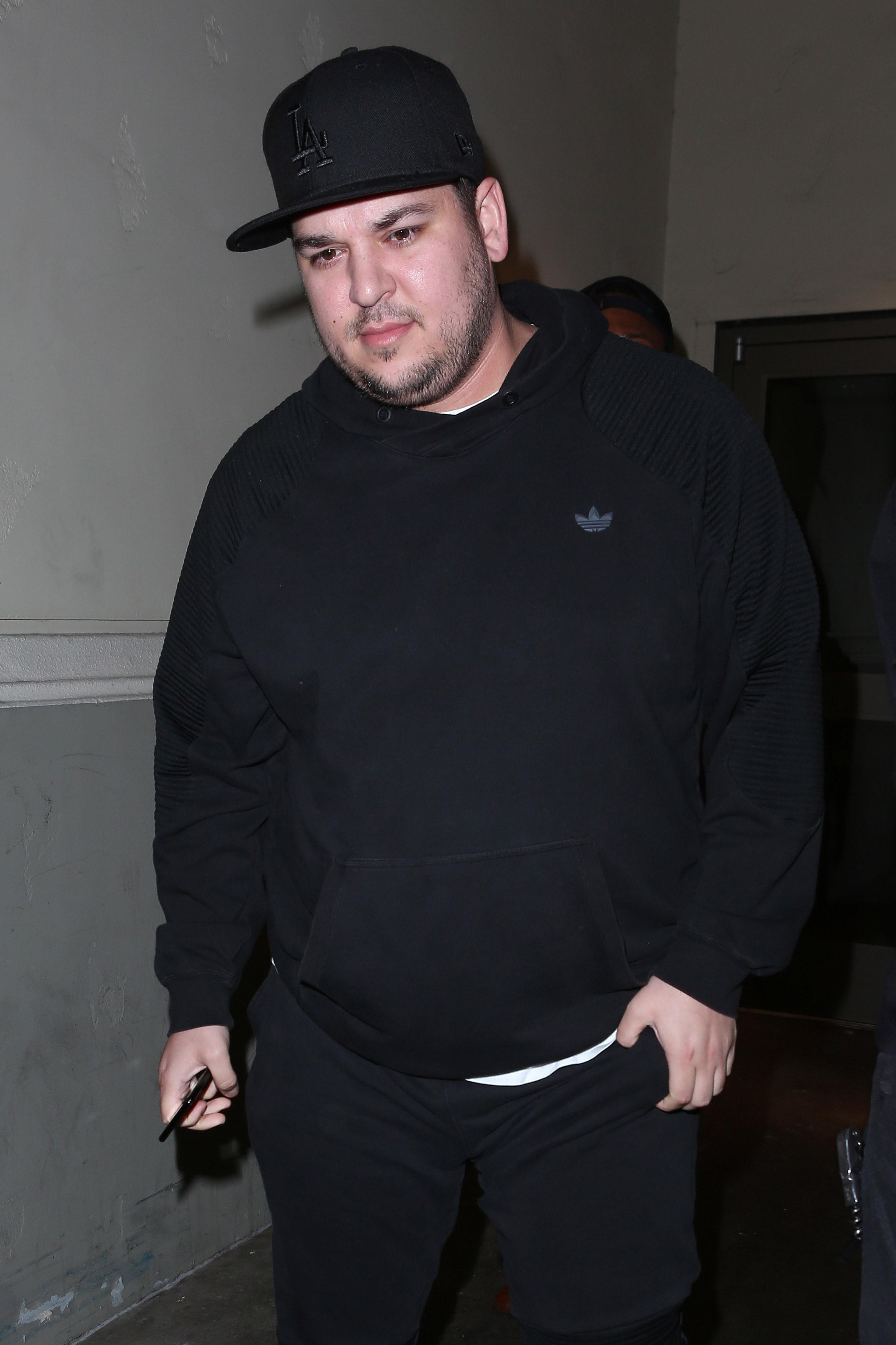 Reclusive Rob Kardashian surfaces for a family movie night