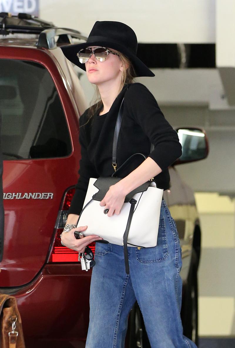 Amber Heard walking into a lawyers office in Beverly Hills