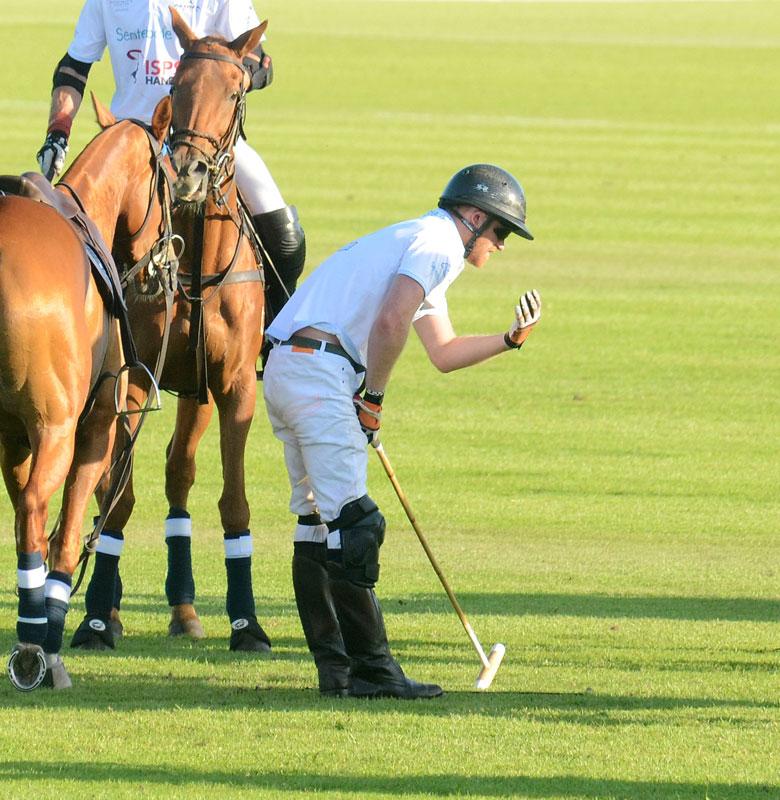 Prince Harry falls off horse during Sentebale charity polo match **USA ONLY**