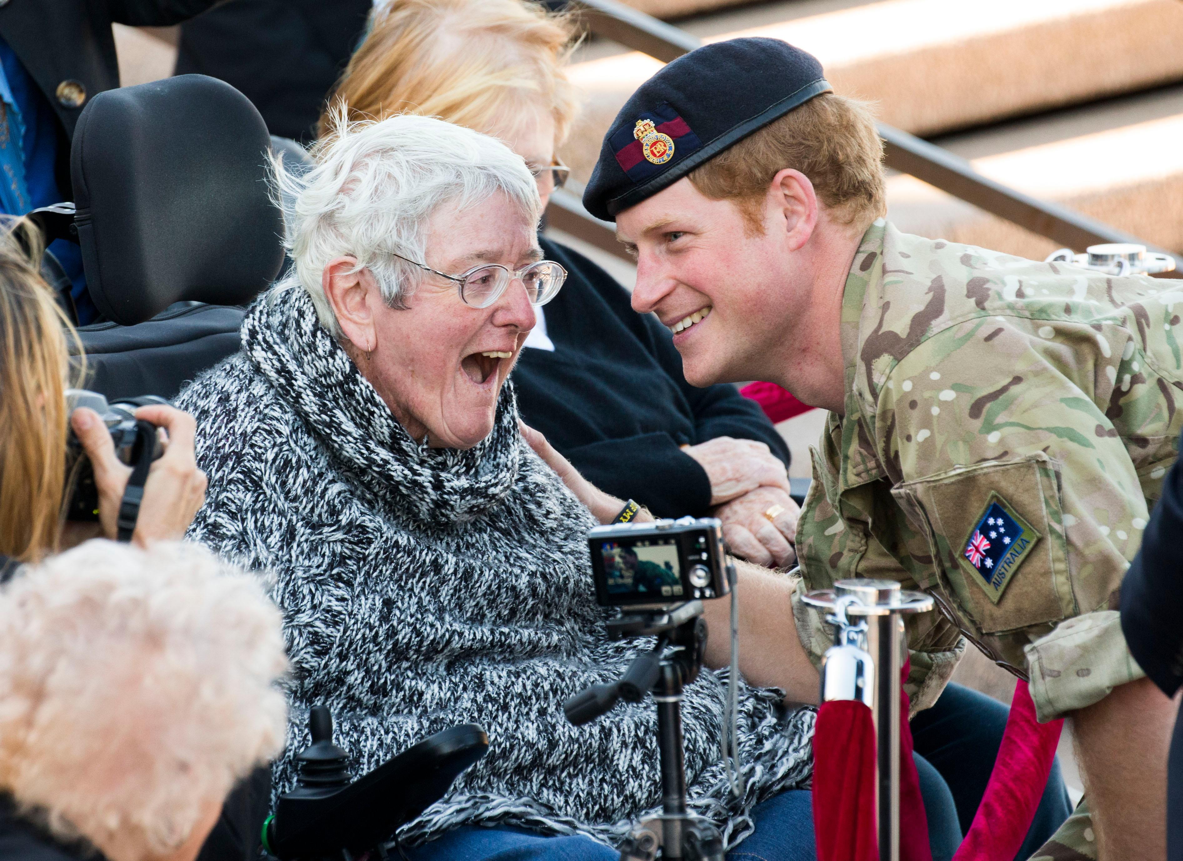 Prince Harry visits with his fans outside the Sydney Opera House **USA ONLY**