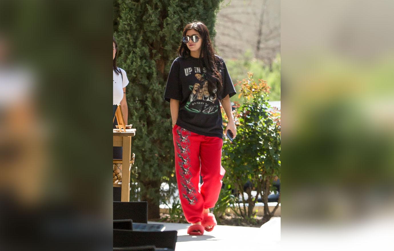 *EXCLUSIVE* Kylie Jenner wears red slippers and weed tee shirt