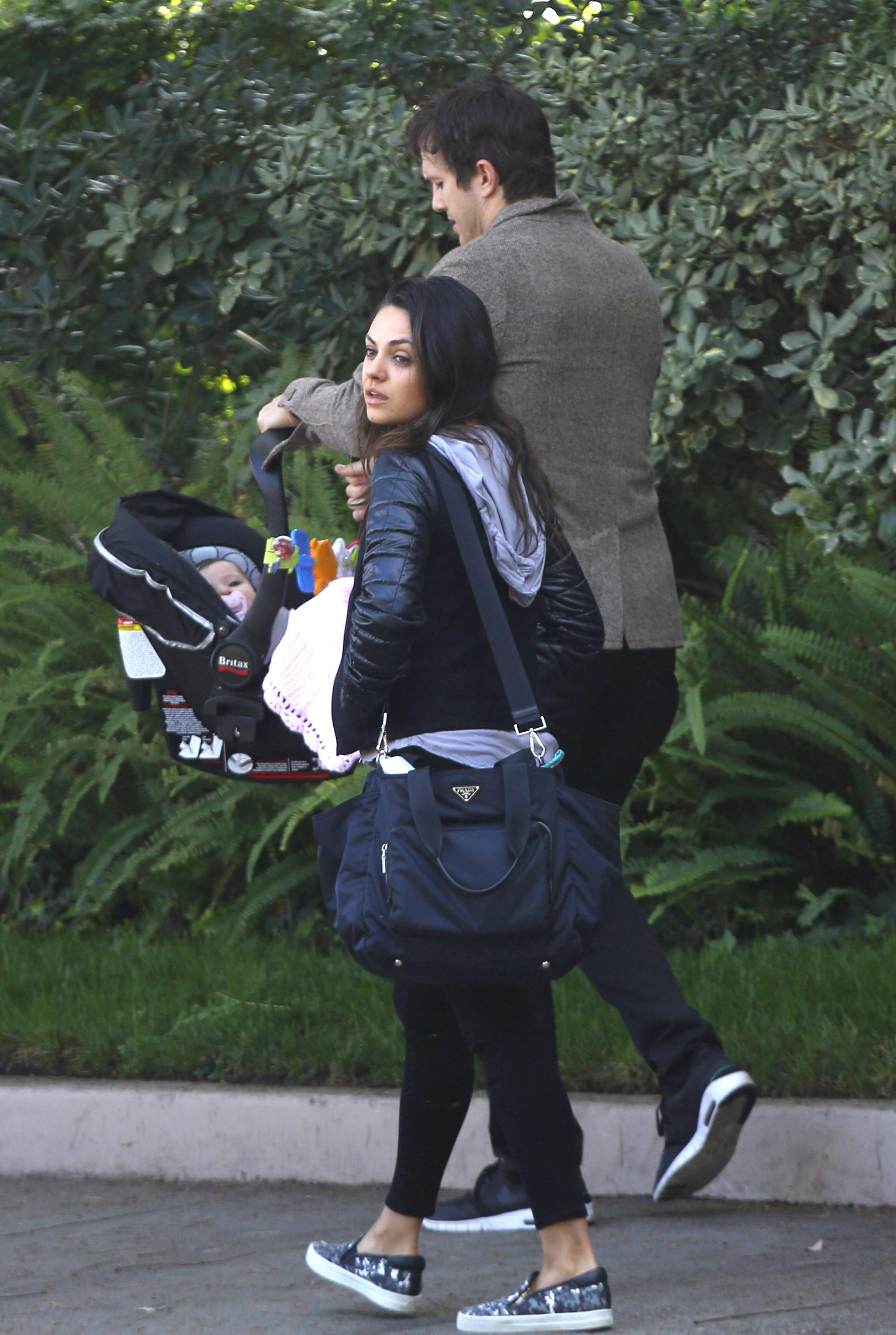 Ashton Kutcher and Mila Kunis enjoy a day out with baby girl Wyatt and parents