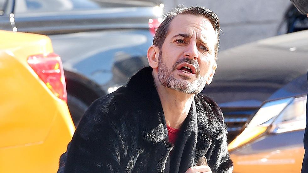 Marc Jacobs stops to do a quick impromptu photo shoot with his bull terrier